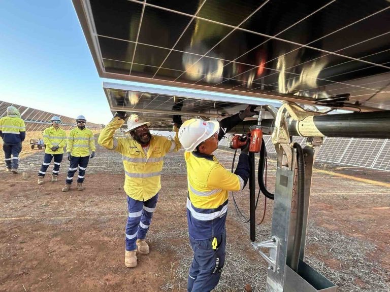 Last panel goes up at first solar-battery hybrid project to connect to Australia’s main grid